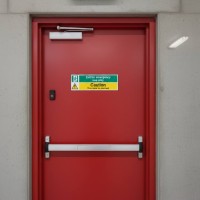 Exit for Emergency Use Only - Caution - Door Is Alarmed