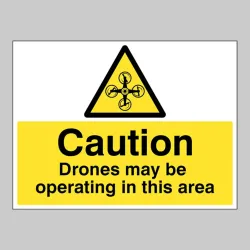 Caution - Drones May be Operating in this Area Caution - Drones May be Operating in this Area