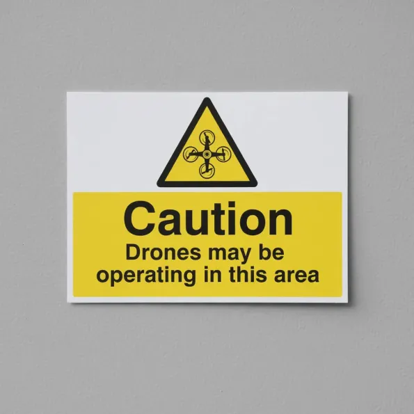 Caution - Drones May be Operating in this Area Caution - Drones May be Operating in this Area